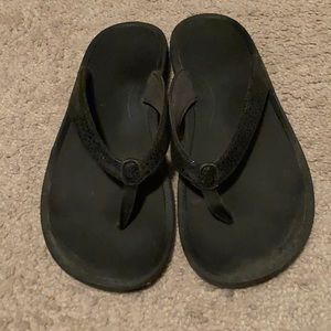 Olukai Women’s black flip flops